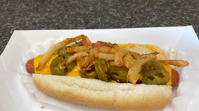The Firecracker: a hot dog with melted cheese, grilled jalapeños and crispy onion tanglers